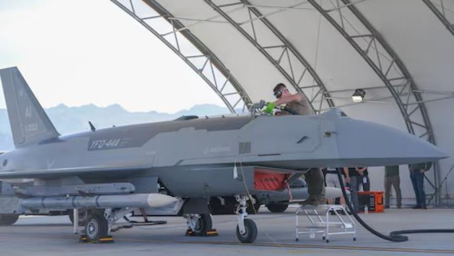 YFQ-44A drone in hangar, airman refuelling 