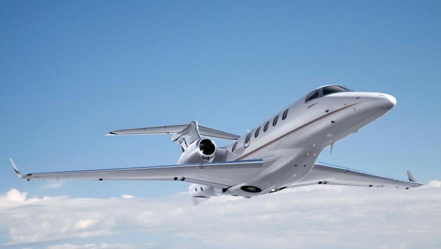 Embraer phenom 300 in flight 