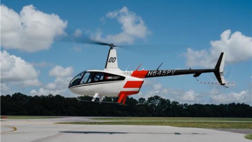 R66 hovering above ground 