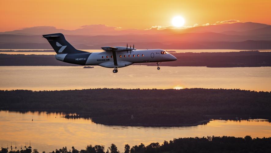 Heart X1 flying over lake at sunset 