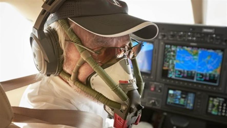 pilot wearing a quick-donning oxygen mask in the cockpit