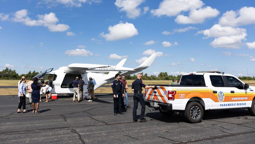 An Alia CX300 draws a crowd alongside a Washington County EMS rescue truck
