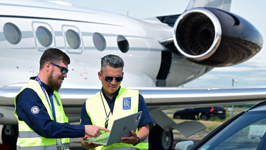 Roll-Royce technicians with engine