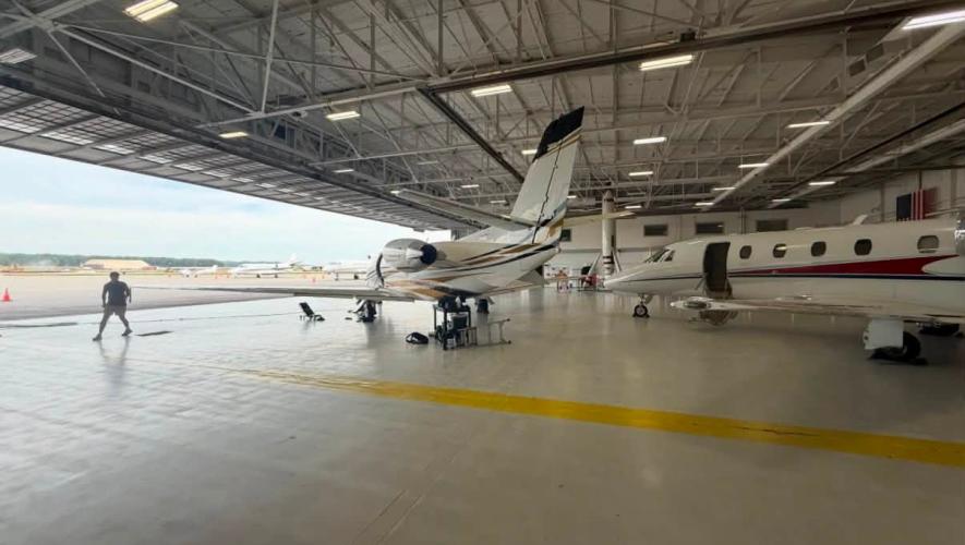 In-house maintenance and detailing crew prepare two of the aircraft for a late-night departure. 