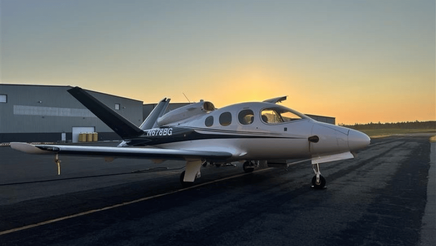 A Cirrus jet on a ramp at dusk