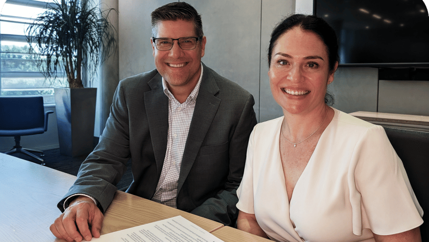 Bill Dolny and Elmarie Marais signing the agreement