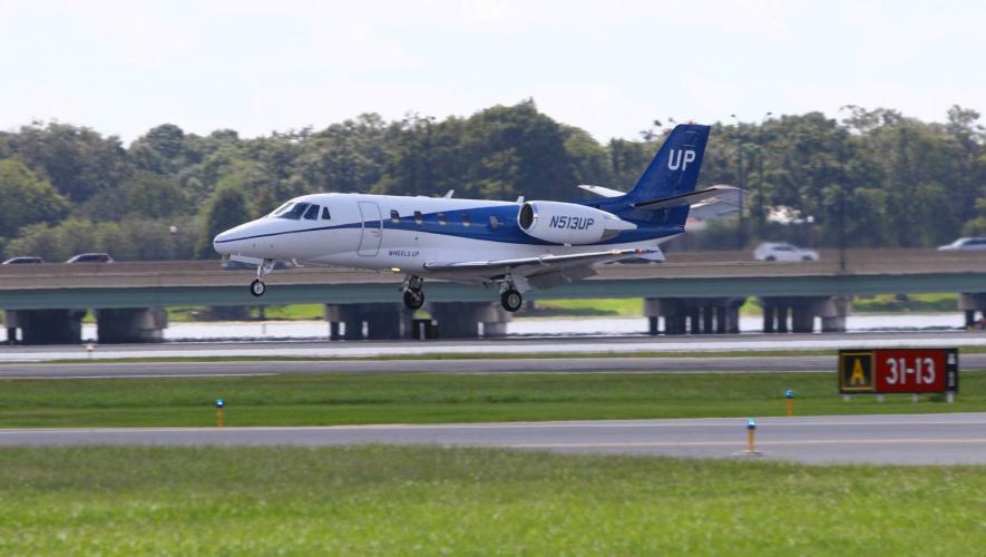 Wheels Up Citation Excel business jet on approach to landing