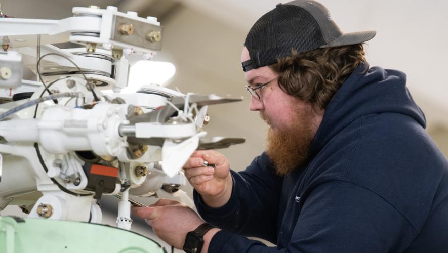 Summit Aviation technician with component