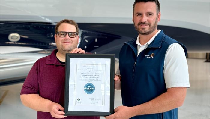 Sonoma Aviation’s safety manager Josh Foster and Clayton Lackey, v-p, present their IS-BAH Stage 3 certification.