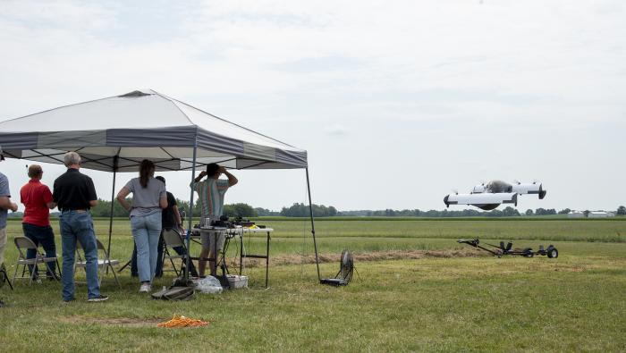 Spectators observe a flight demonstration of Pivotal’s Blackfly personal eVTOL aircraft.