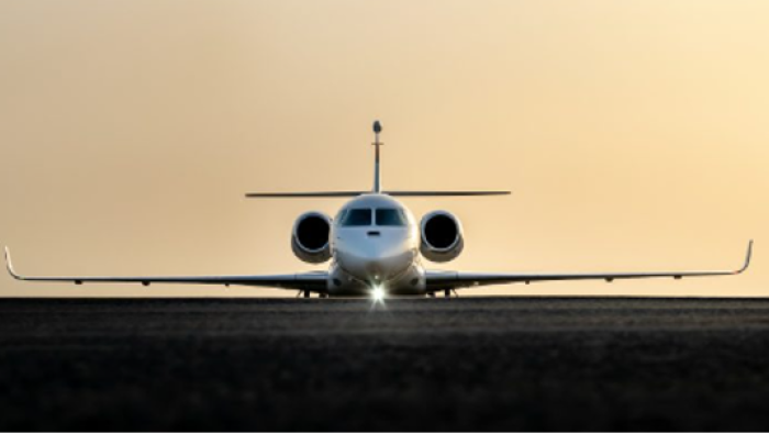 a Dassault Falcon jet facing away from the camera