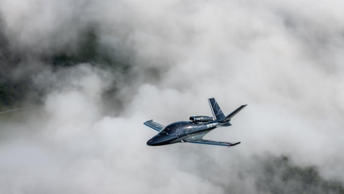 Cirrus Vision Jet single-engine jet in flight over clouds