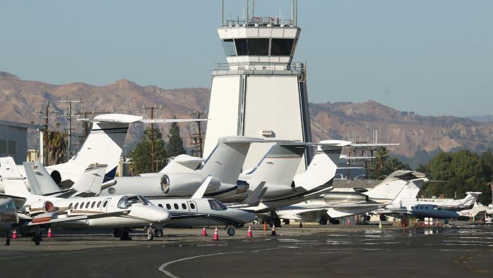 business jets on ramp in front of tower at Van Nuys Airport