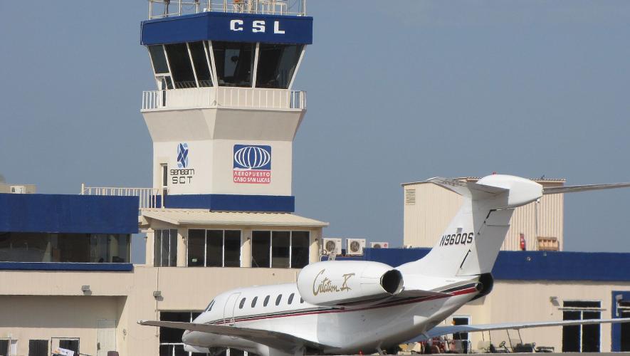 Air Traffic Control Tower at Cabo San Lucas Airport with U.S.-registered business jet parked on airport ramp