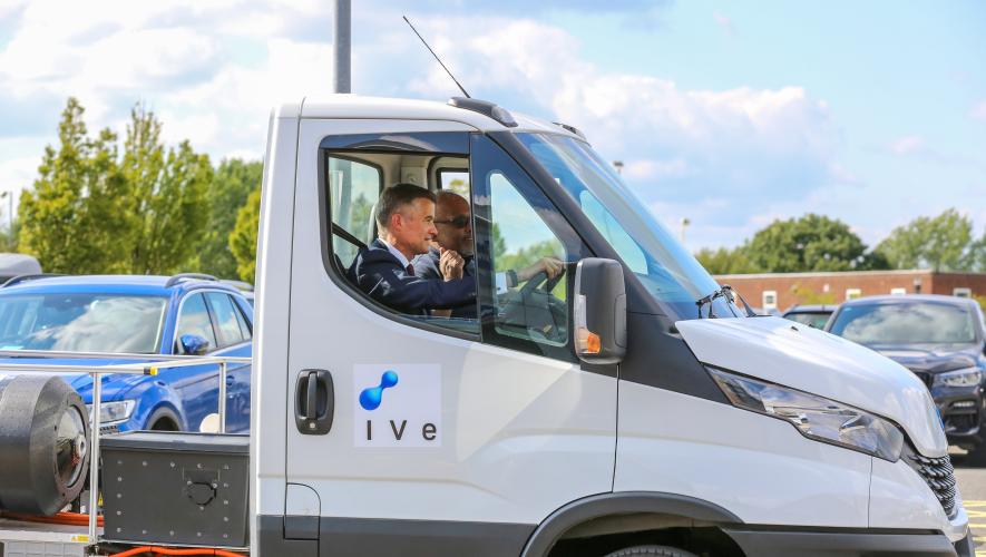 UK transport secretary Mark Harper drives a hydrogen ground vehicle at Teesside Airport. 