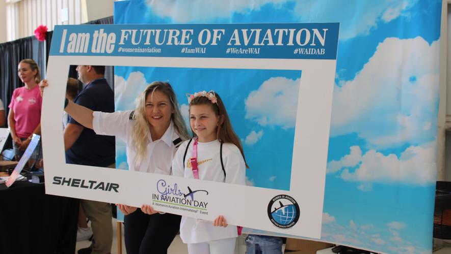 Posing for photo at Girls in Aviation Day