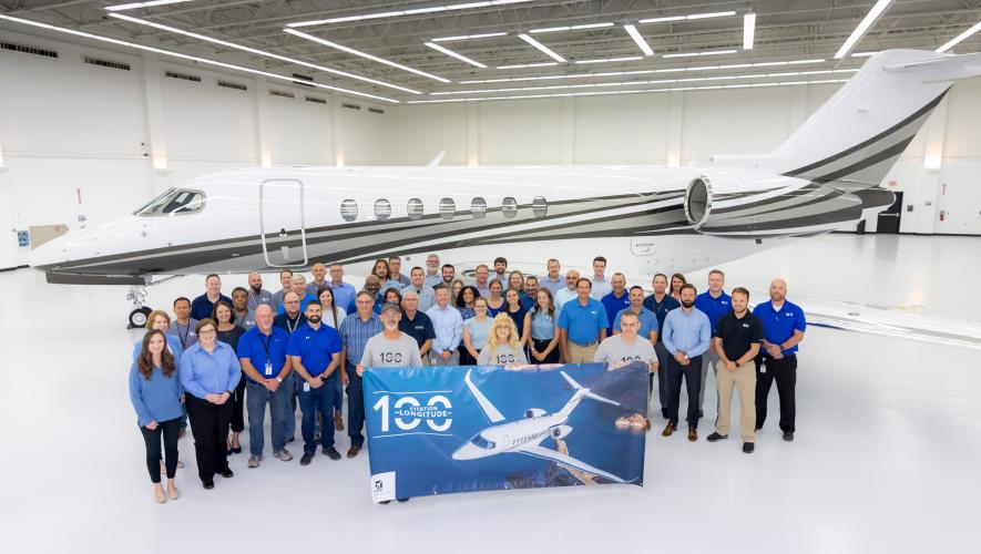 Textron Aviation employees pose for a group photo with the 100th Citation Longitude