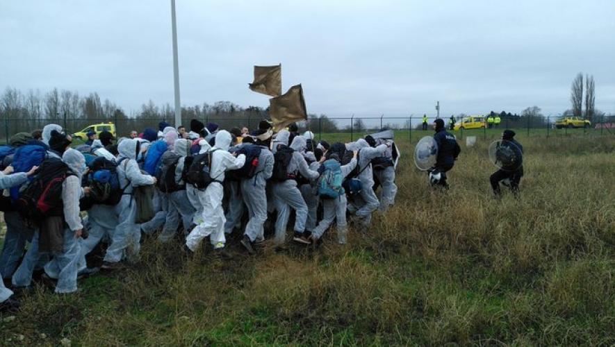 climate activists from Eco-protesters try to enter the secure area of Antwerp-Deurne Airport