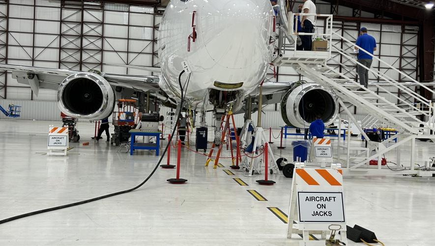 King Aerospace techs work on a Boeing BBJ