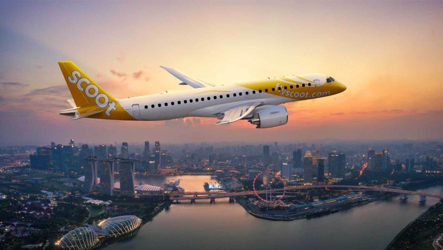 A digital rendering of an E190-E2 with Scoot livery flying over Singapore