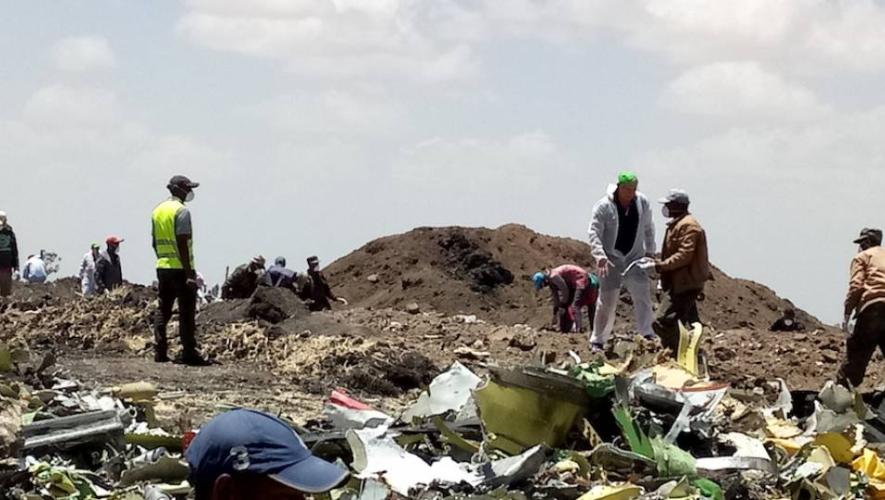 Recovery crews sift through the wreckage of the Ethiopian Airlines Boeing 737 Max