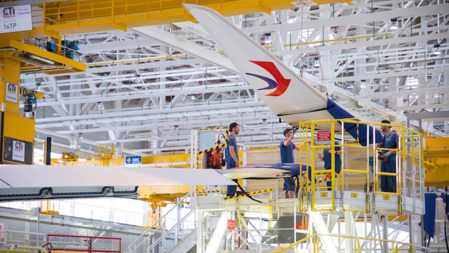Airbus technicians perform winglet fitting on a China Eastern A350-900.
