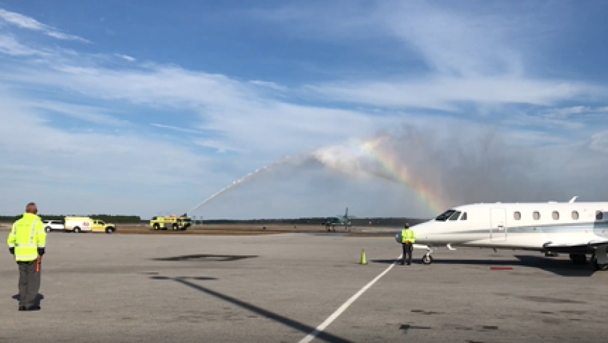 private jet receiving water salute