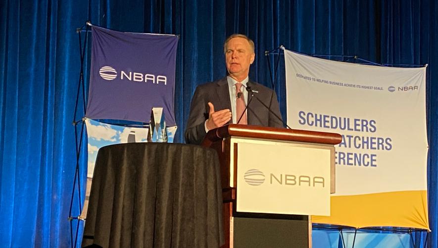 NBAA president and CEO Ed Bolen speaks on stage at SDC 2023