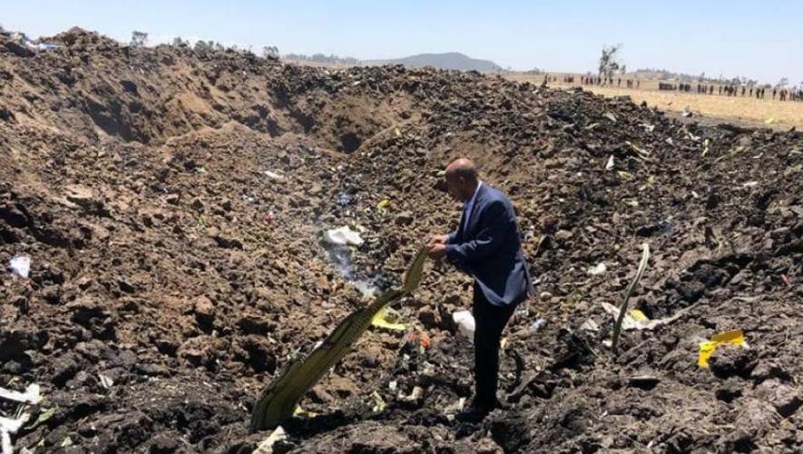 Former Ethiopian Airlines CEO Tewolde Gebremariam inspects wreckage from Flight ET 302 outside Addis Ababa in March 2019. 