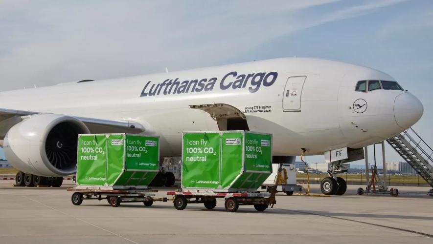 Lufthansa Cargo Boeing 777 Freighter on airport ramp awaiting loading of cargo crates