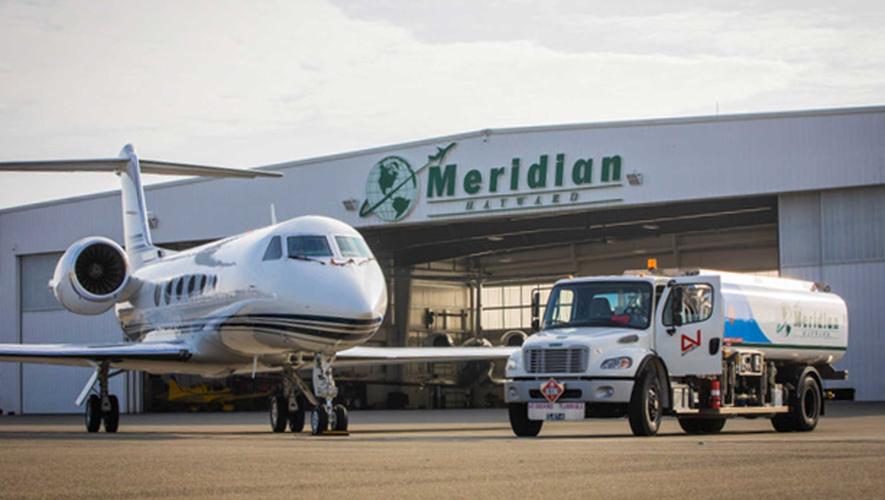 Meridian Hangar at Hayward Executive Airport with fuel truck and business jet parked in front