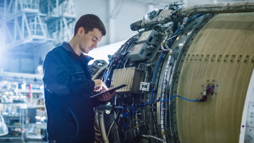 Vortex technician working on aircraft engine
