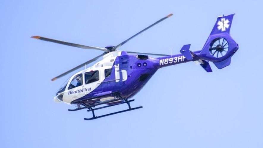 Health First EC135 air ambulance helicopter in flight
