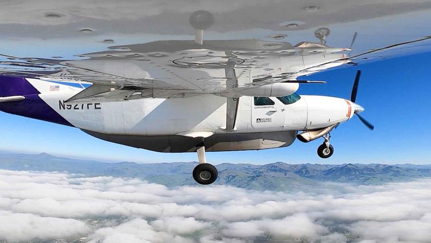 Reliable Robotics' Cessna 208 Caravan flying over clouds