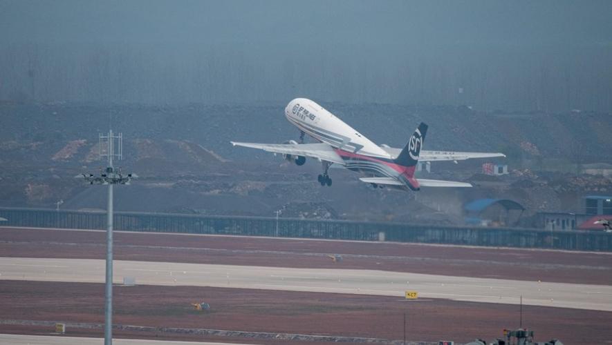 An SF Airlines Boeing 757 takes off for a flight trial at Ezhou Huahu Airport on March 19, 2022