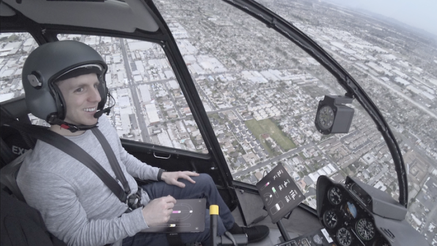 Skyryse founder and CEO Mark Groden piloting a FlightOS system equipped Robinson R44 helicopter