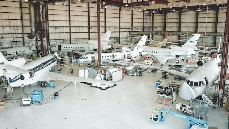 West Star hangar with multiple business jets being serviced