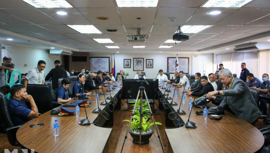 Representatives from several Philippine authorities around conference table