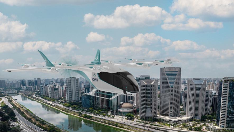 A digital rendering shows Eve's eVTOL aircraft with Voar branding flying over a city skyline.