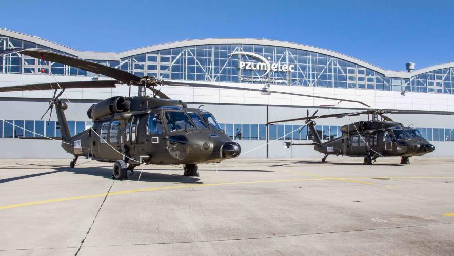 A pair of Sikorsky Black Hawks grace the tarmac outside PZL Mielec's factory in Poland.