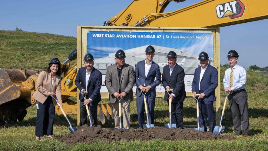 Officials from West Star Aviation, St. Louis Regional Airport, and Contegra Construction pose for a ground breaking ceremony marking West Star's expansion of its facility in East Alton, Illinois.
