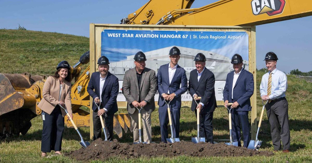 Officials from West Star Aviation, St. Louis Regional Airport, and Contegra Construction pose for a ground breaking ceremony marking West Star's expansion of its facility in East Alton, Illinois.