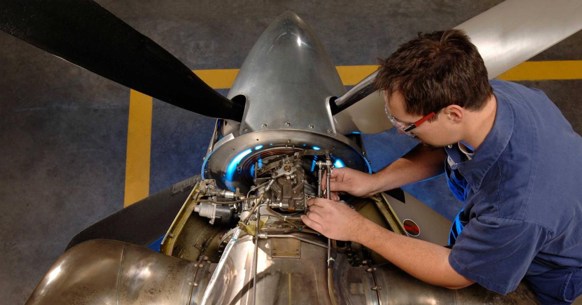 Pratt & Whitney technician working on PT6A engine