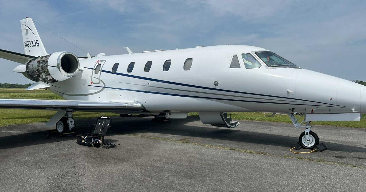 FlyExclusive's Cessna Citation Excel on airport ramp with engine cowling removed for SmartSky connectivity installation