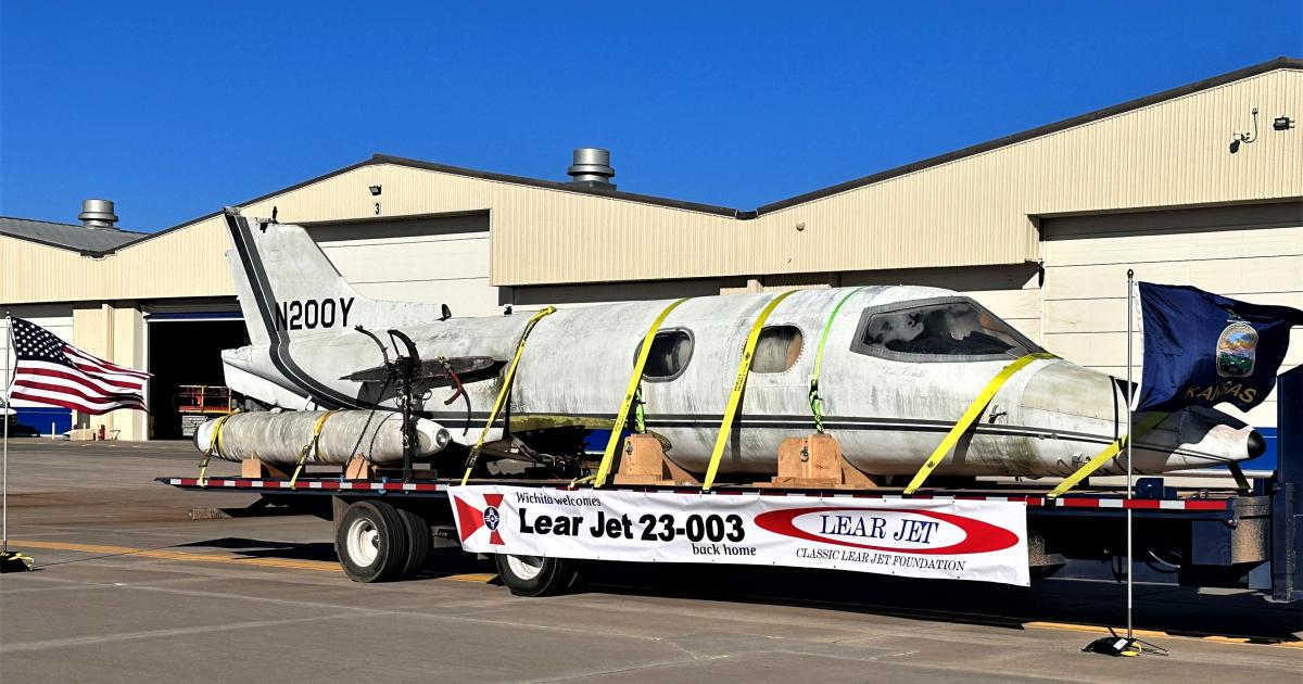 The fuselage of Learjet 23-003 on a dolly