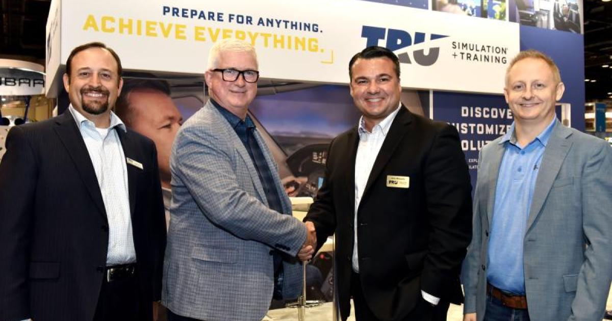TRU, EIC and Keewatin Air principals celebrate a King Air sim sale