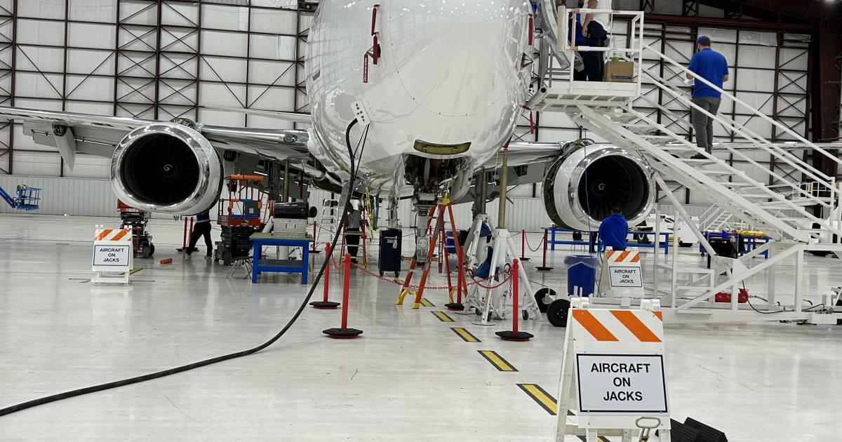 King Aerospace techs work on a Boeing BBJ