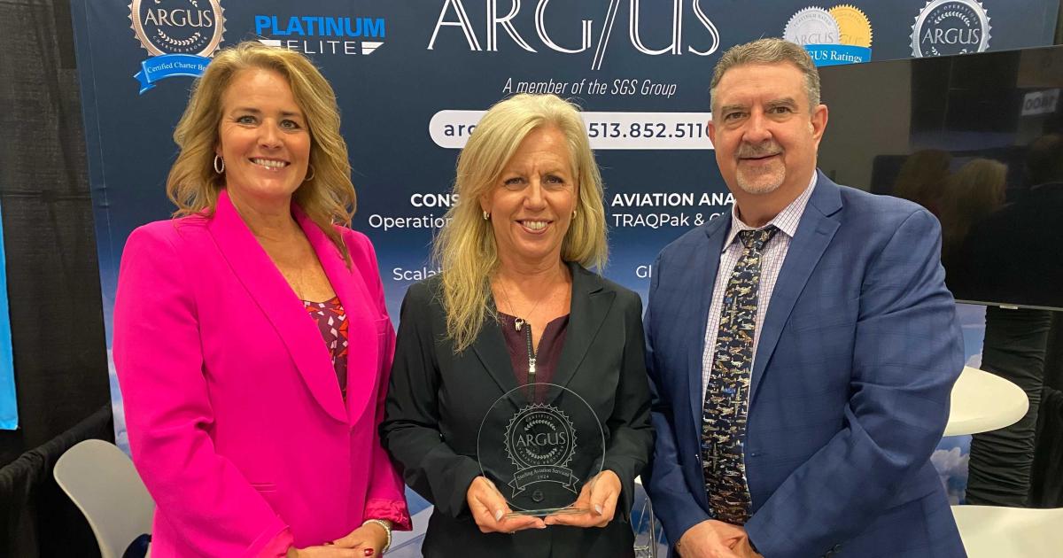 Sterling Aviation leadership accepts award from Argus v-p Ed Wandall