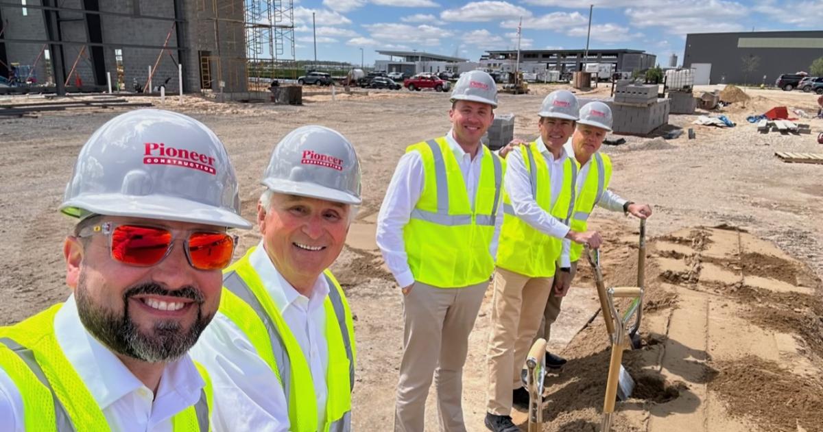 Executives from Pioneer Construction participate in a ground breaking ceremony for a new Pro Star Aviation hangar in Grand Rapids, Michigan
