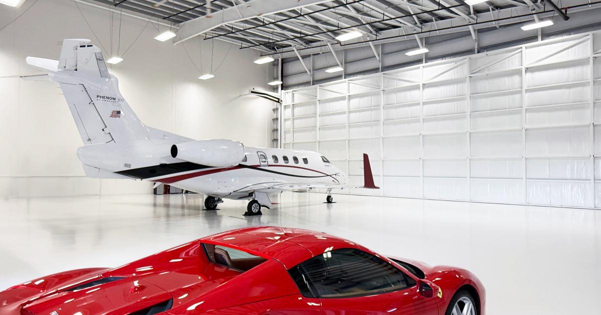 Private jet and Ferrari in private hangar